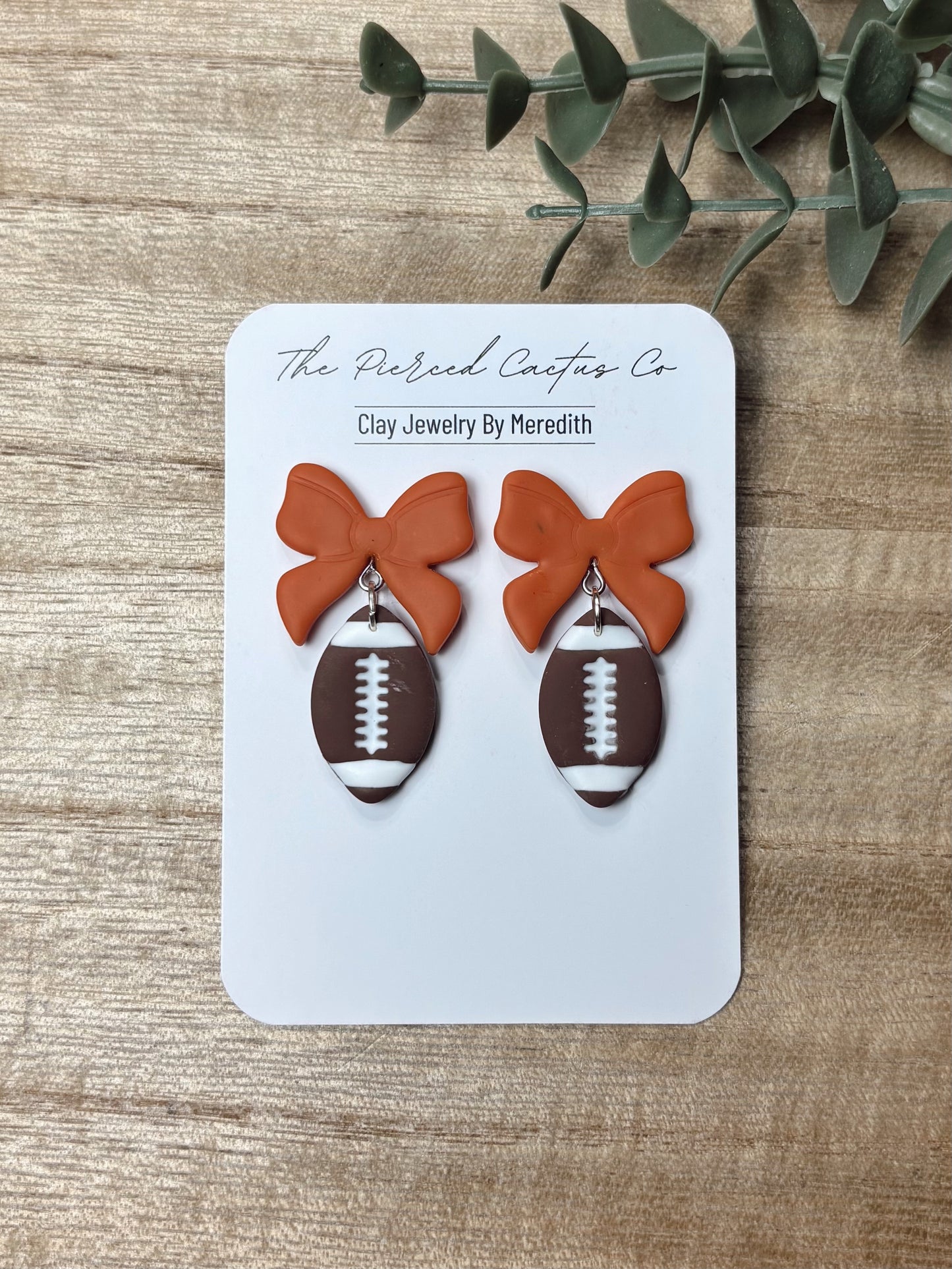 Football Bow Dangle Earrings – Handmade Clay Jewelry | The Pierced Cactus Co.