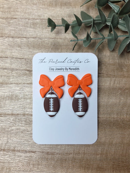 Football Bow Dangle Earrings – Handmade Clay Jewelry | The Pierced Cactus Co.